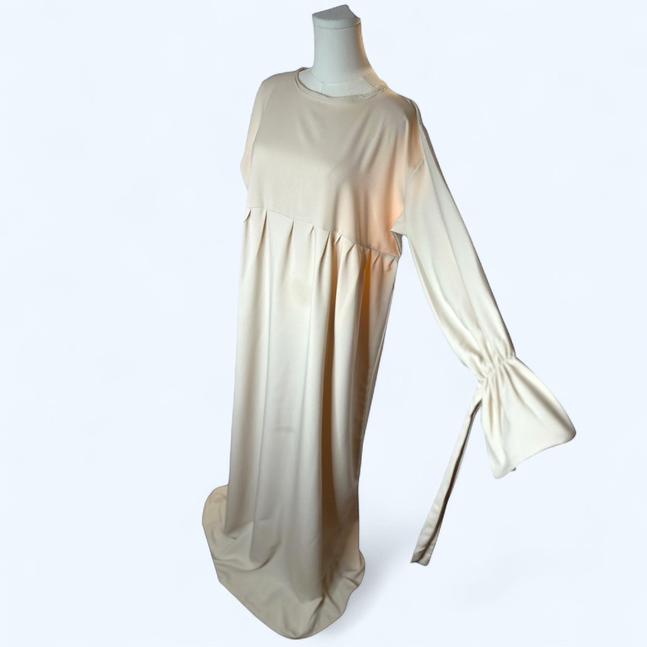 Long beige dress with gathered sleeves