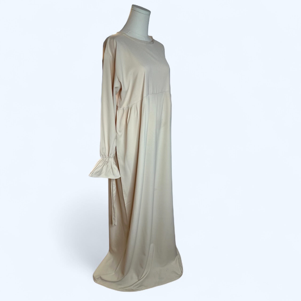 Long beige dress with gathered sleeves